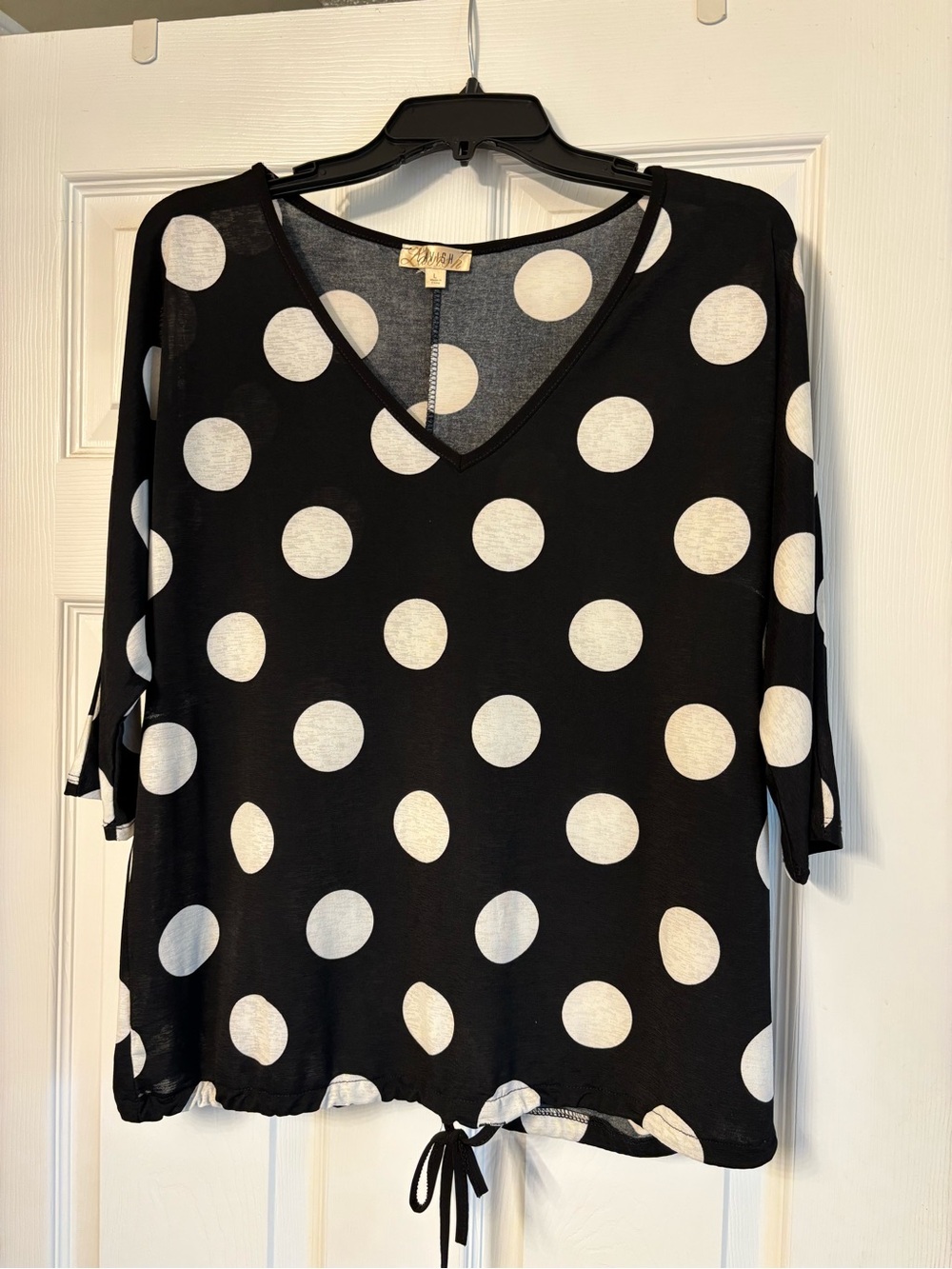 Like new Black & White Polka Dot V-Neck Tie-Hem Top. Sz L